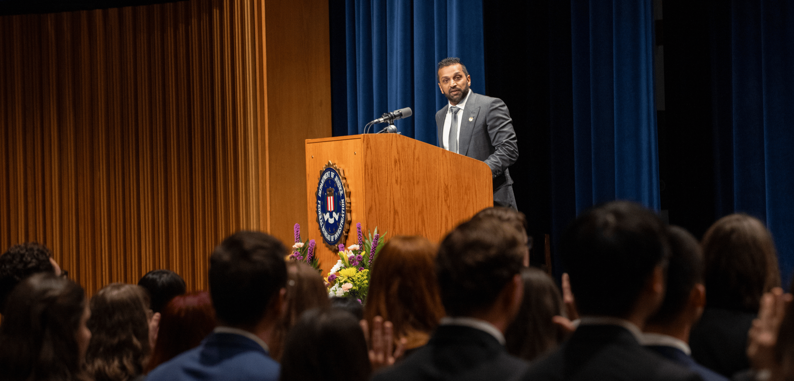 Kash Patel speaking at podium